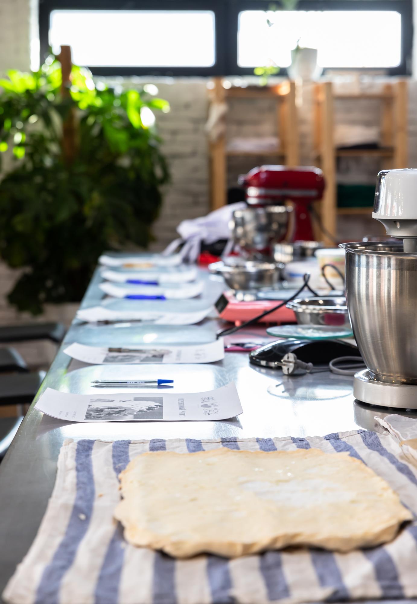 Table with arranged cooking tools and notes